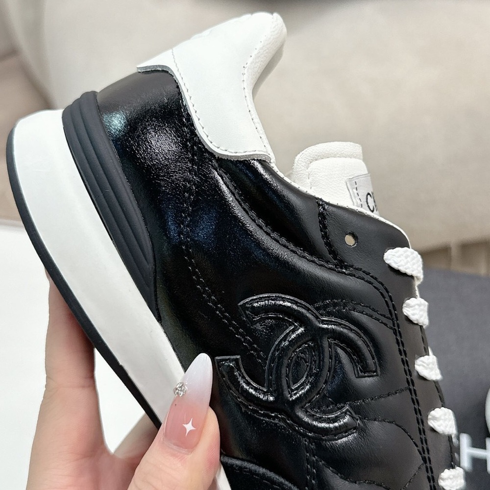 Women's Chanel Black Quilted Patent Leather White Lace-Up Sneakers - Picture 7 of 7